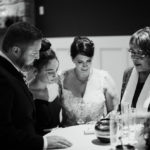 Black and white photo of an intimate wedding ceremony