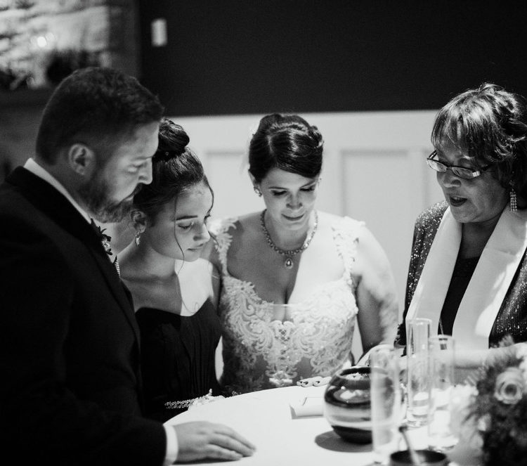 Black and white photo of an intimate wedding ceremony